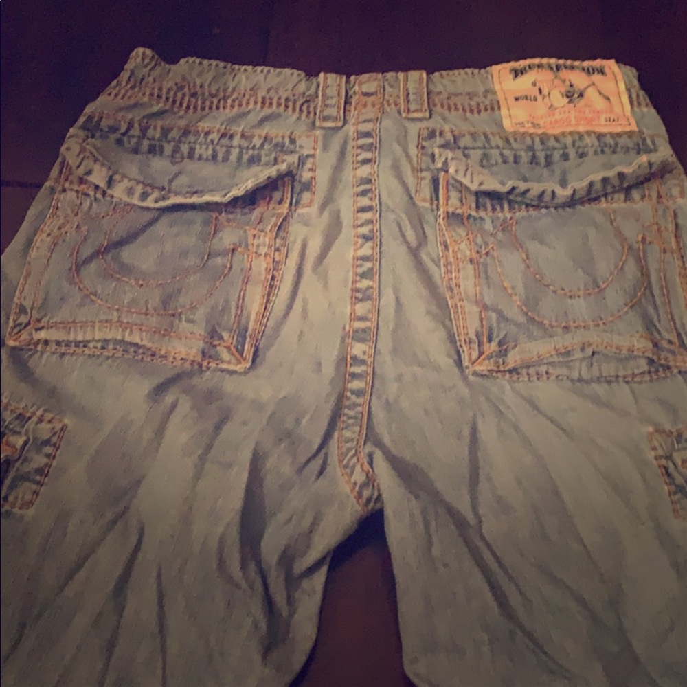 3 pair of True Religions. Red, White and Denim